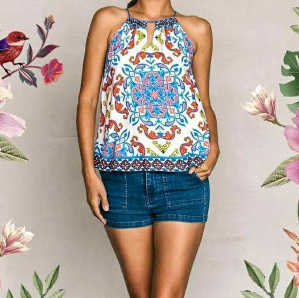 Beautiful halter top with tassle tie backs.